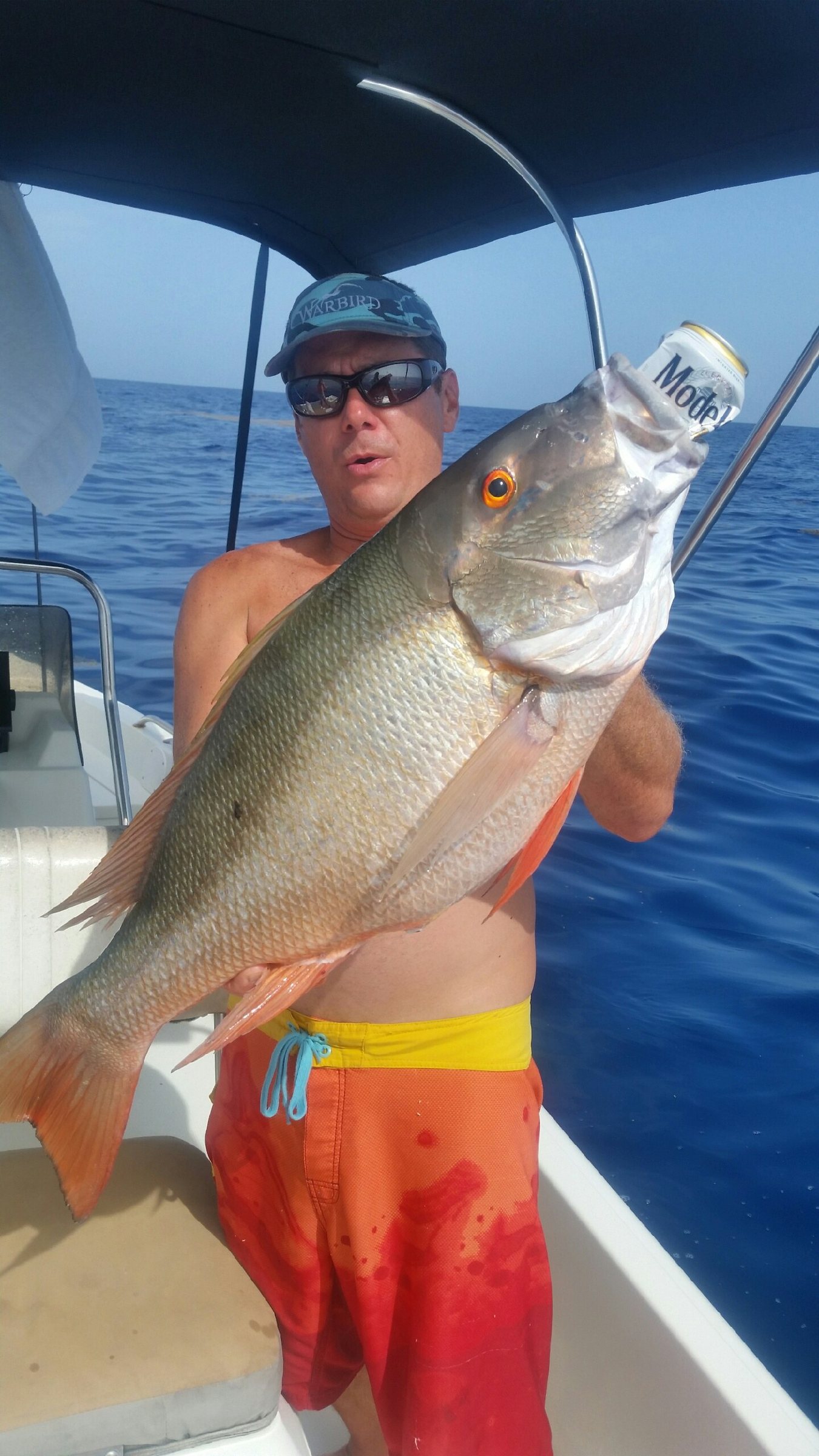 Angler with a snapper caught on a family fishing trip with Captain Key Largo