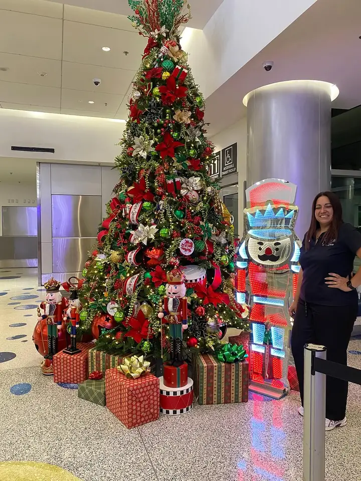 Large Christmas display with a life size nutcracker in a Miami lobby