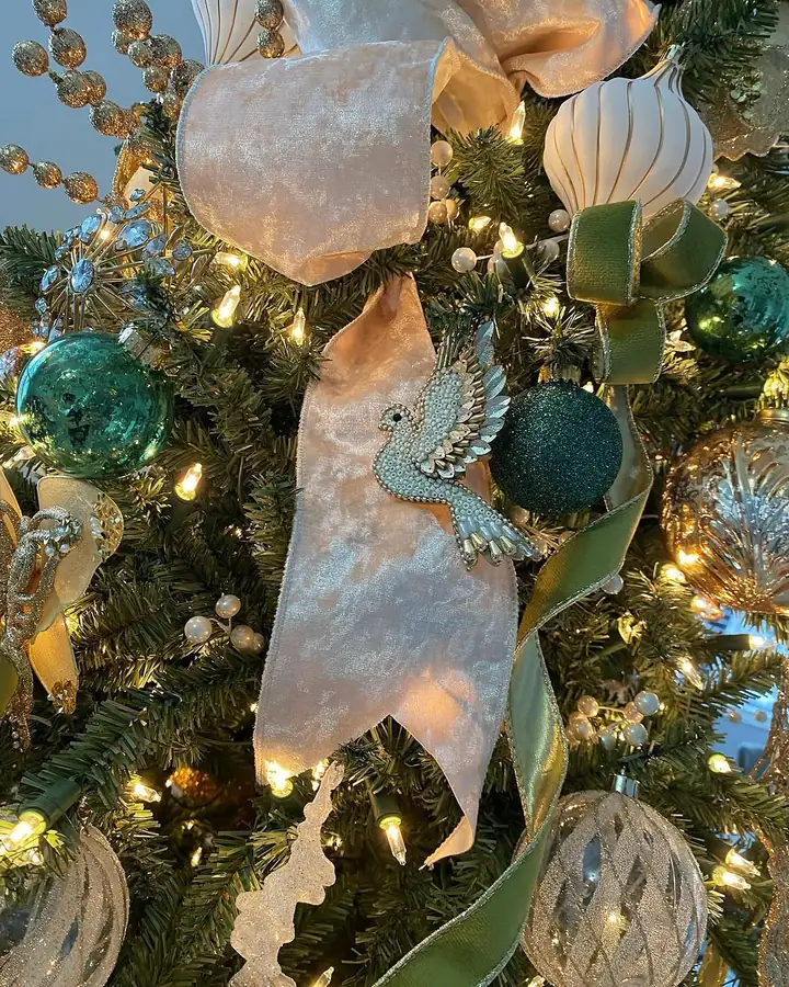 Sheer gold ribbon worked into the branches of a decorated tree