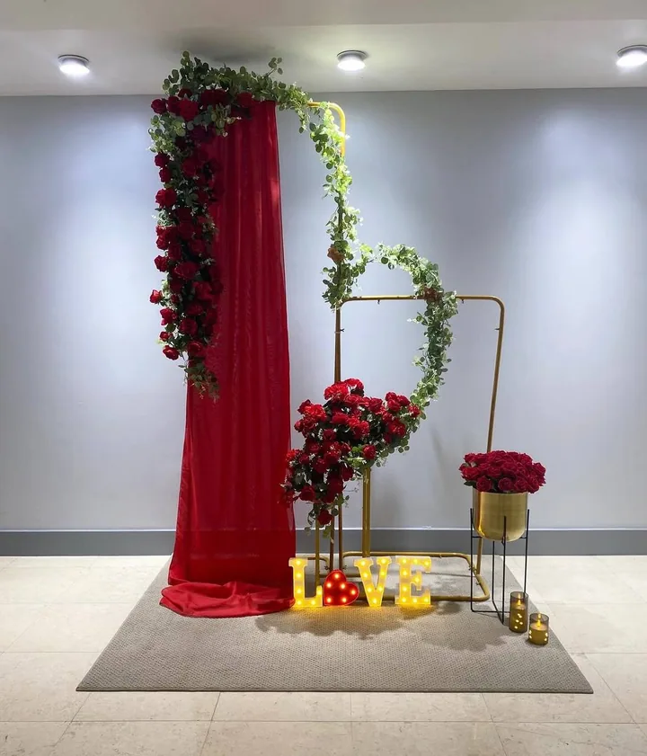 Valentine's Day backdrop with red roses, draping and LOVE letters
