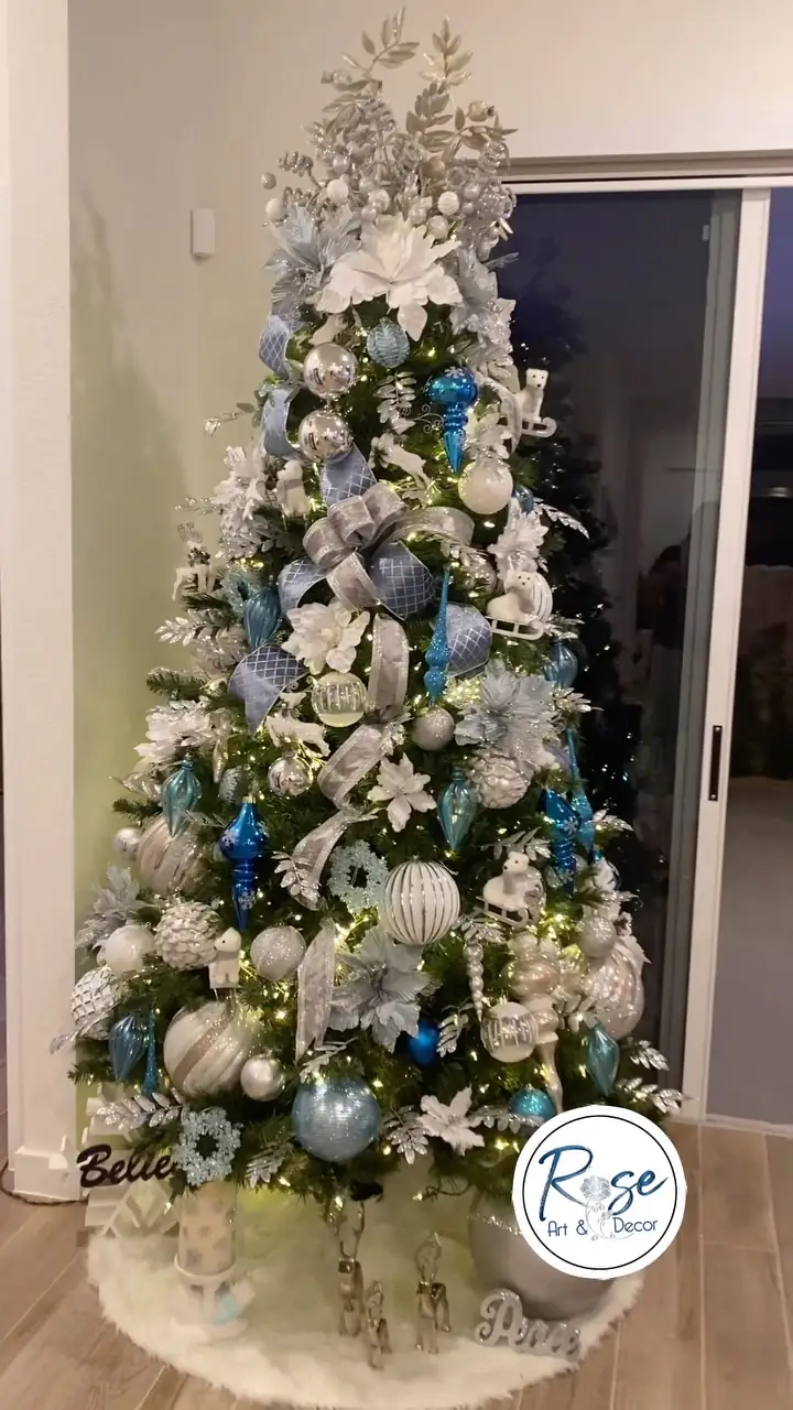 Blue and silver Christmas tree in a white Miami room